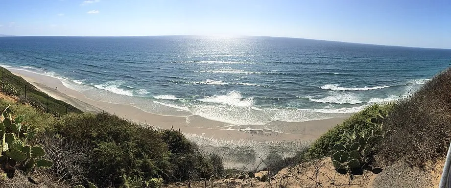 The bluff-top railing and ocean view at the J Street viewpoint